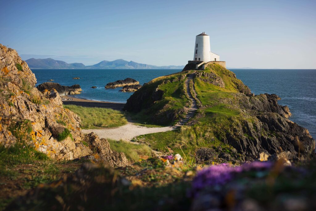 Ynys Llanddwyn island with a lighthouse on a small hill