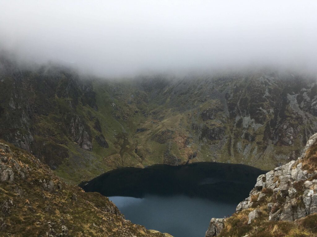 mist above closed lake on Caidar Idris in Wales