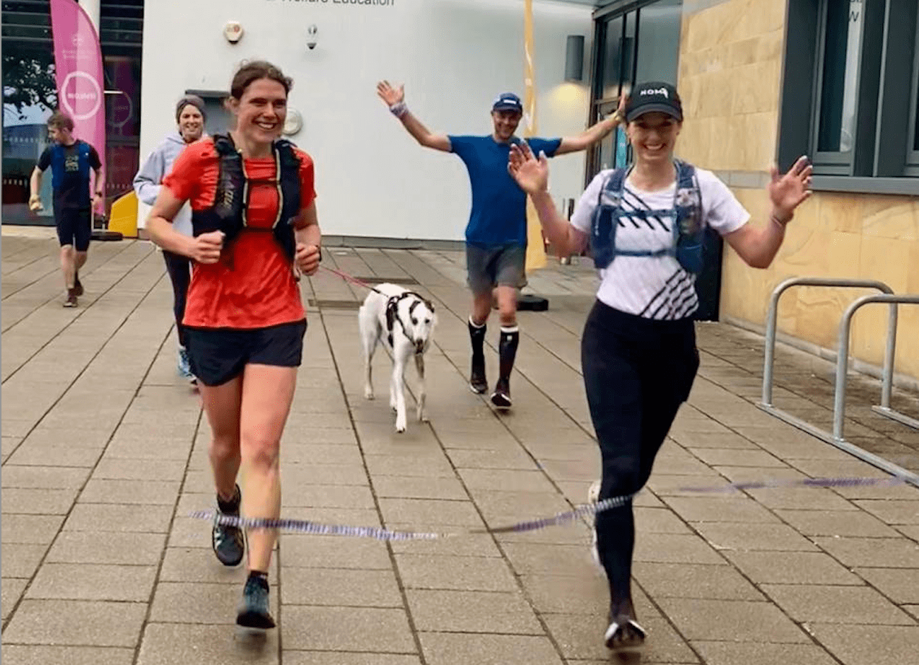 women crossing the finish line after 38 marathons in 38 days