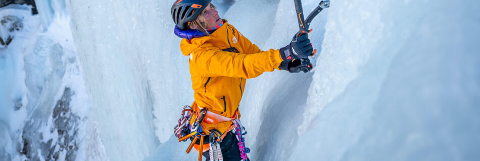 Fay Manners ice climbing in Italy with ice pick and crampons