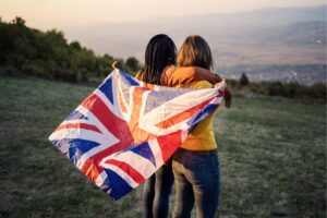 Two people hugging with a union jack flag
