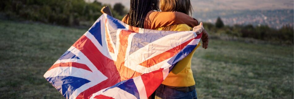 Two people hugging with a union jack flag